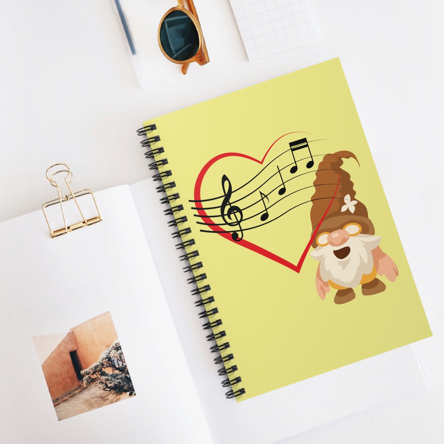 Notebook with a gnomes and music notes design on office table theme
