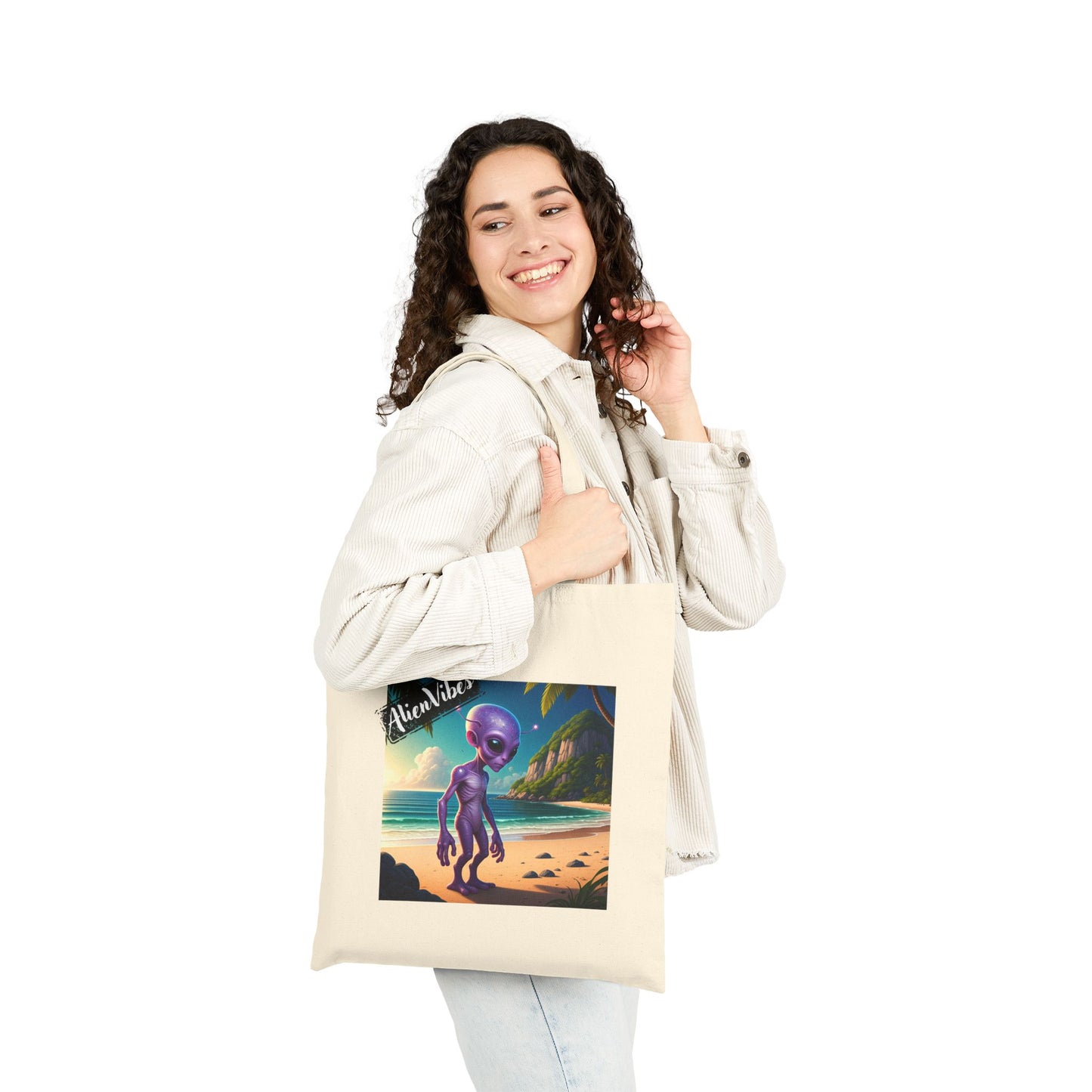 Alien at Beach natural color tote bag: a funny alien walking on a sandy beach. Bag on woman shoulder.