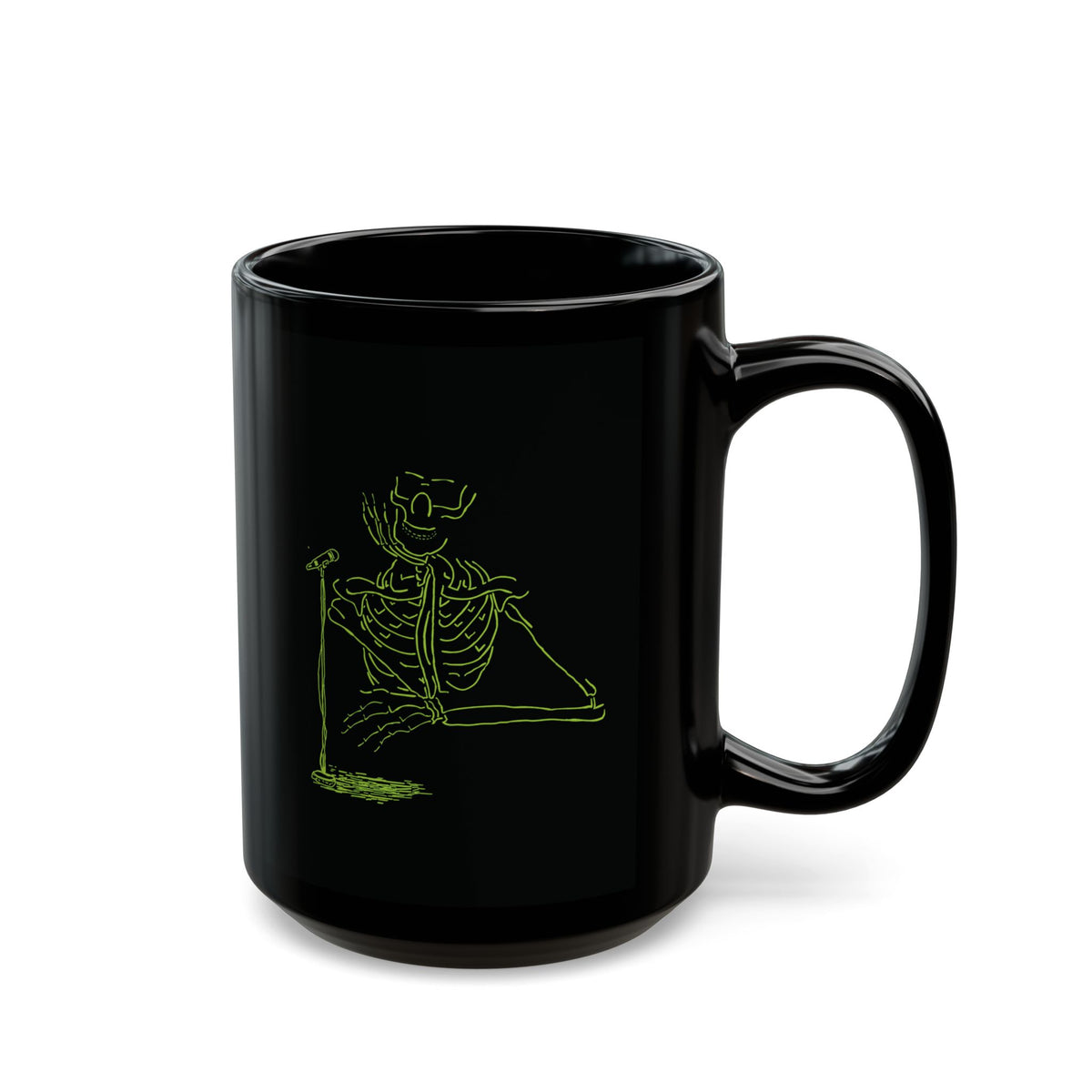 Large 15oz black ceramic mug displaying a glowing fluorescent green skeleton drummer artwork, isolated studio product shot for rock band members and metalheads.