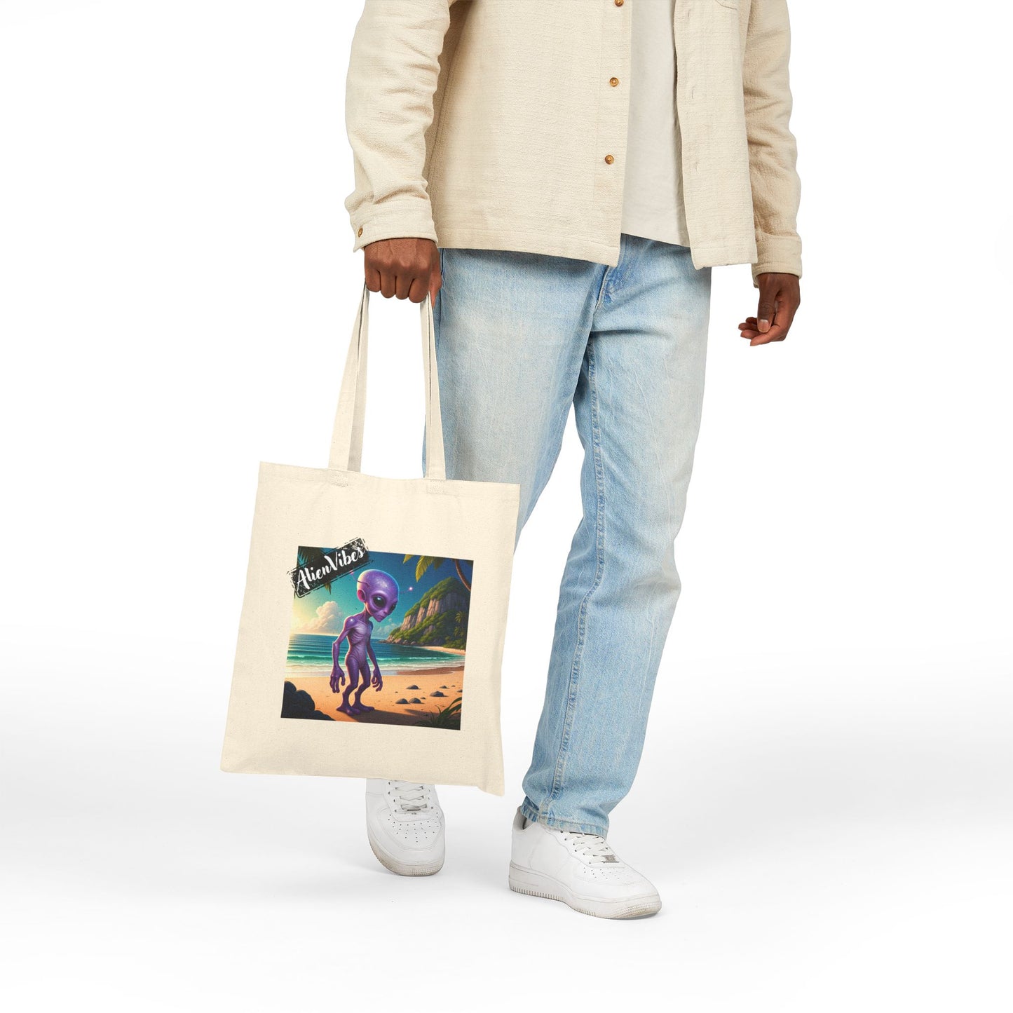 Alien at Beach natural color tote bag: a funny alien walking on a sandy beach. Man fashion.