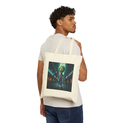 Alien playing sax in a empty city at Night. The alien Is featured on a Natural color Canvas tote bag on a young man shoulder.
