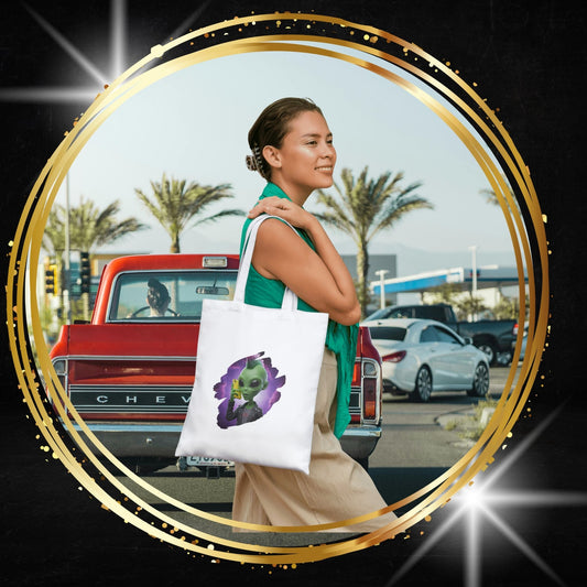 Woman holding a tote bag with a original design of a punk alien at mobile phone in New York city.
