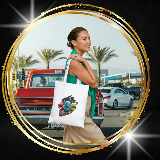 Woman holding a tote bag with a unique alien dancer design in New York city.