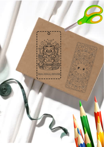 Kraft paper with printed design, scissors, and colored pencils on a white background