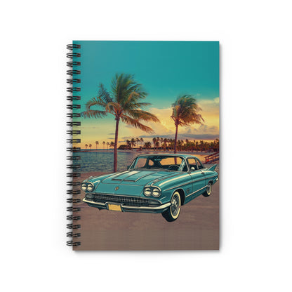 Notebook with a classic Cadillac Eldorado car and palm tree design on a beach at sunset.