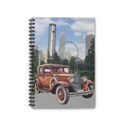 Notebook with vintage car design on a cityscape cover