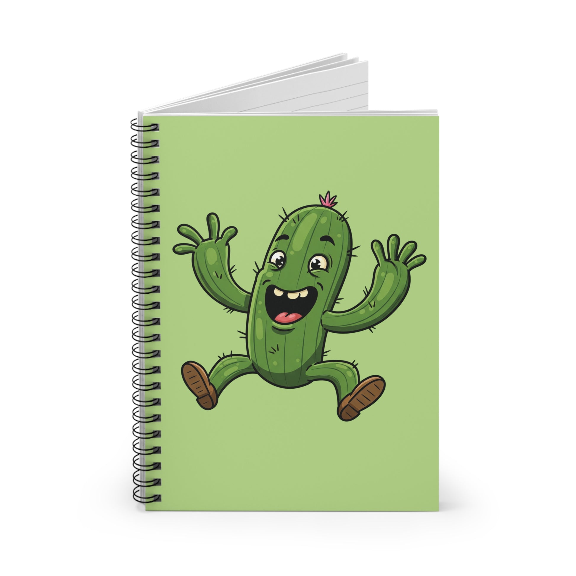 Close-up image of a spiral notebook with a funny cartoon jumping cactus graphic on the cover. Humorous stationery item for students and plant enthusiasts.