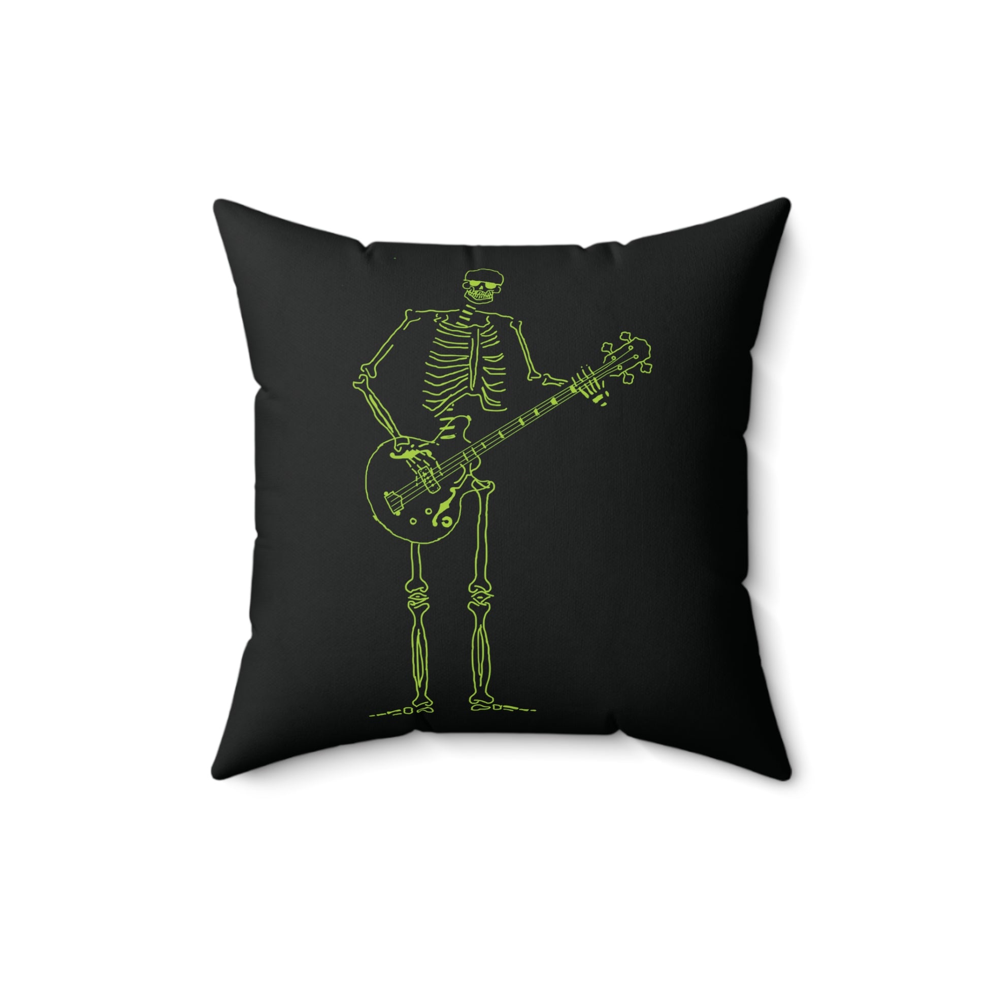 Fluorescent green skeleton playing a bass guitar on a decorative pillow.
