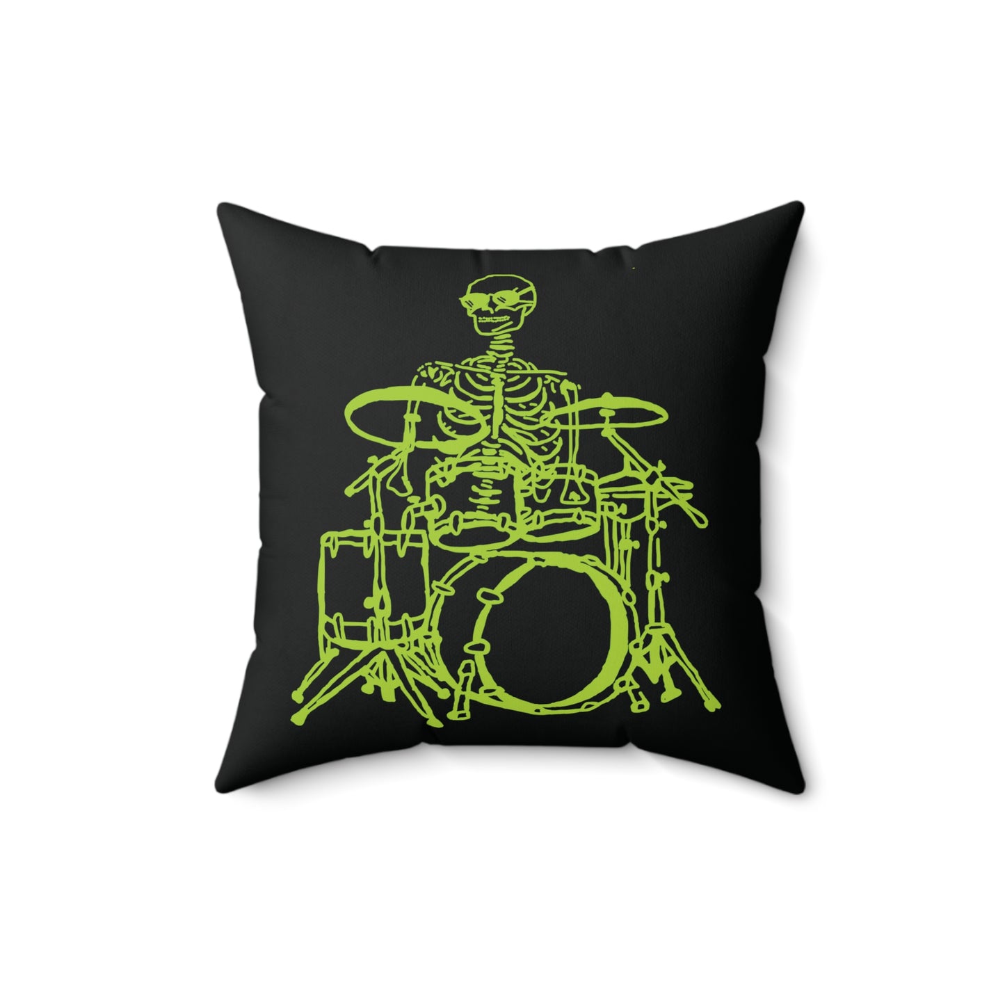 Fluorescent green skeleton playing a drum kit on a white throw pillow.