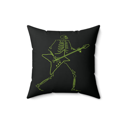 Neon green skeleton shredding on a star-shaped guitar on a white pillow.
