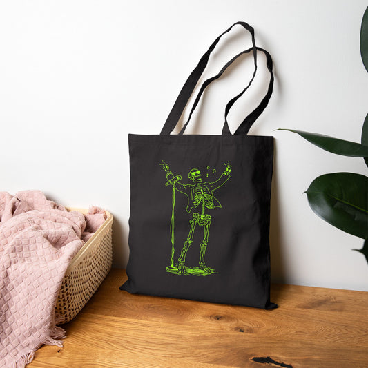 Metal skeleton fluo on a fashion tote bag on the floor