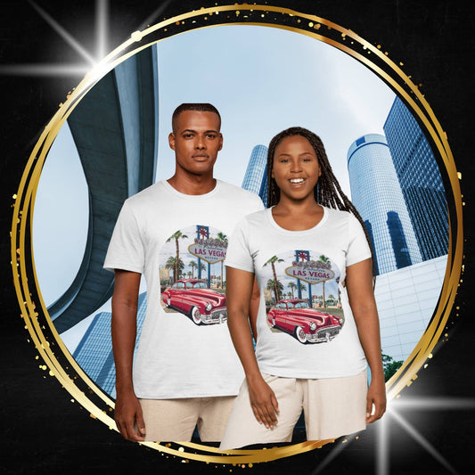 Two people wearing t-shirts with a vintage Buick 1950s original design with a Las Vegas design in front of a cityscape.