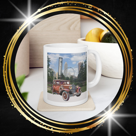 White Mug with a vintage car and cityscape design on a coaster.