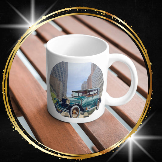 White mug with a White mug with a buick doctor coupe vintage car and beach design on a wooden surface.
