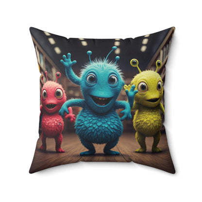 Decorative space pillow with colorful alien dancers characters on a wooden floor.