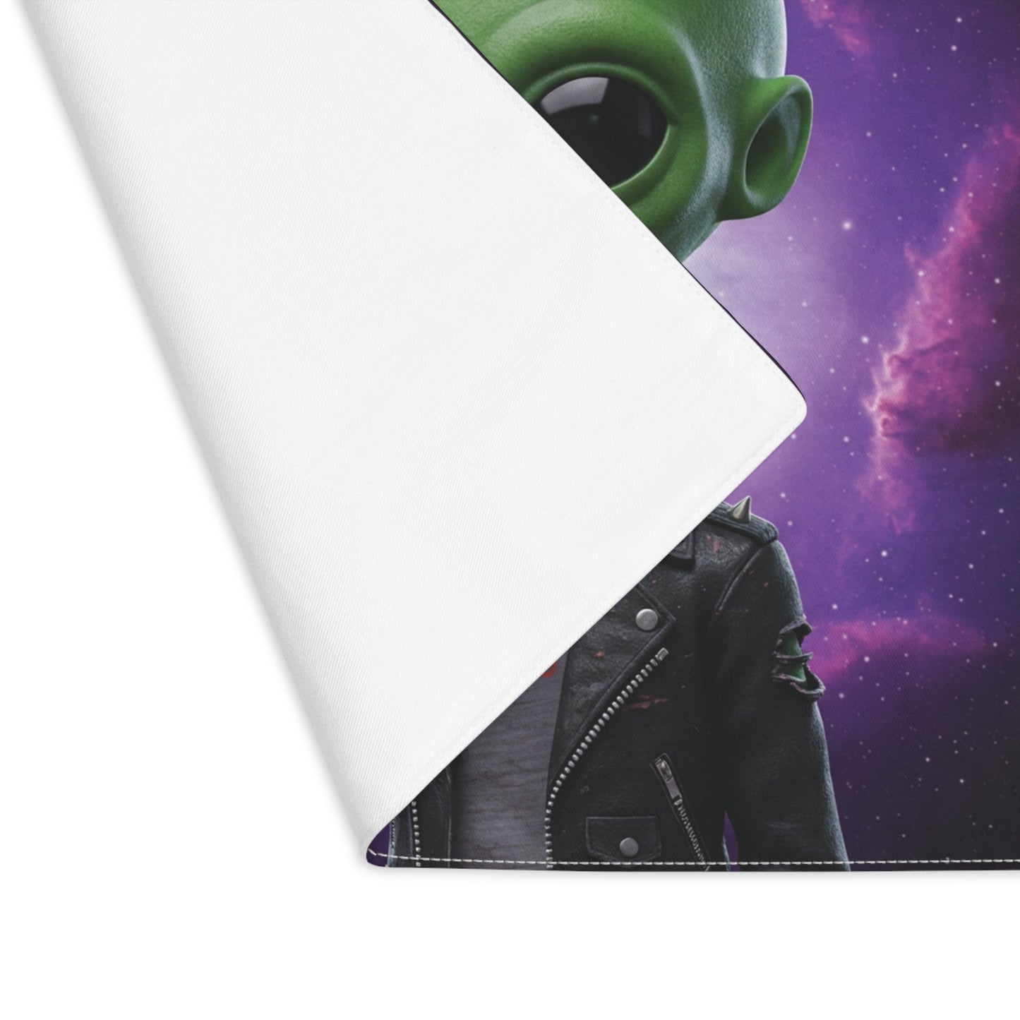 Roll of vinyl with alien and leather jacket design on a space-themed background