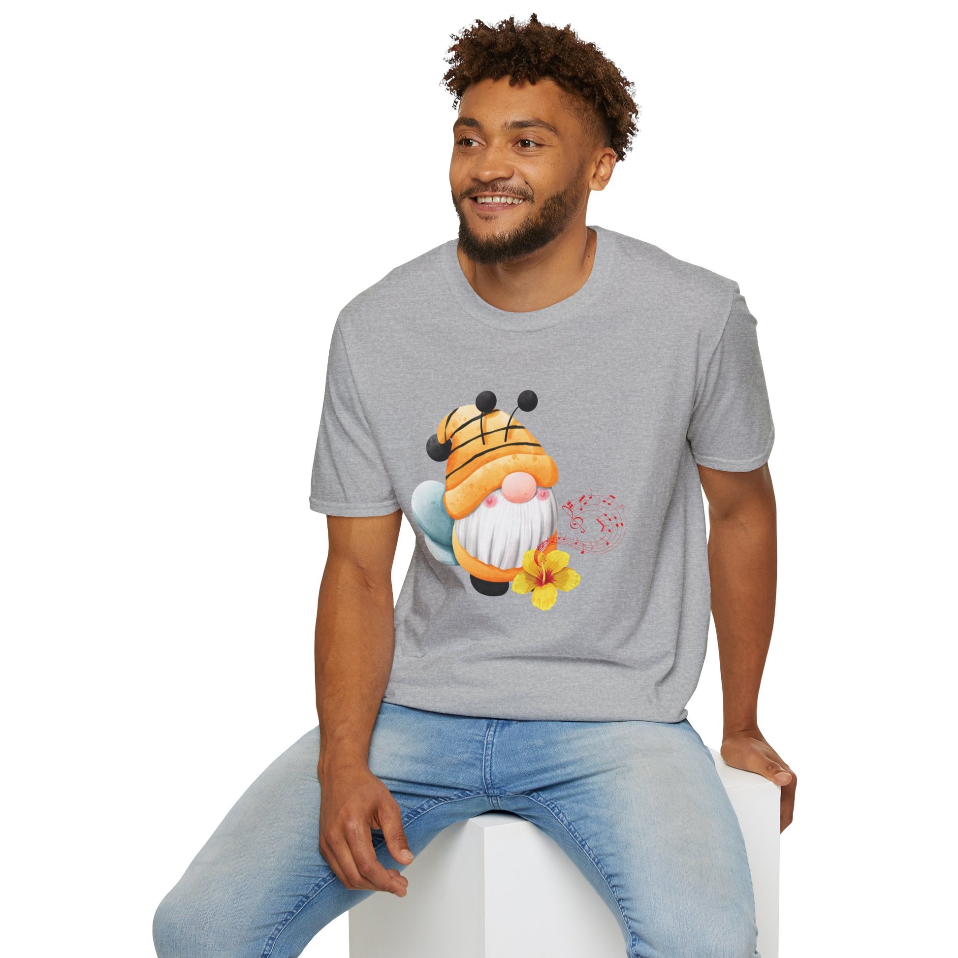A man wearing a heather gray t-shirt with a bee gnome original graphic.