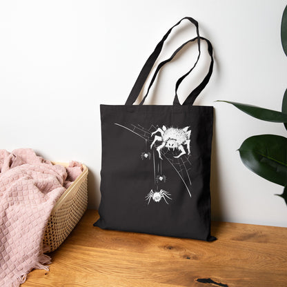 Black tote bag with white spider design