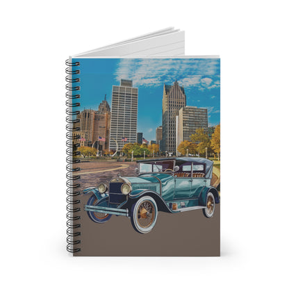 Notebook with a vintage Buick coupé car and cityscape design on the cover