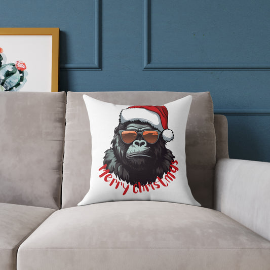 Decorative Christmas throw pillow featuring a cool gorilla wearing a Santa hat and sunglasses on a cozy living room couch, adding funny holiday decor flair.
