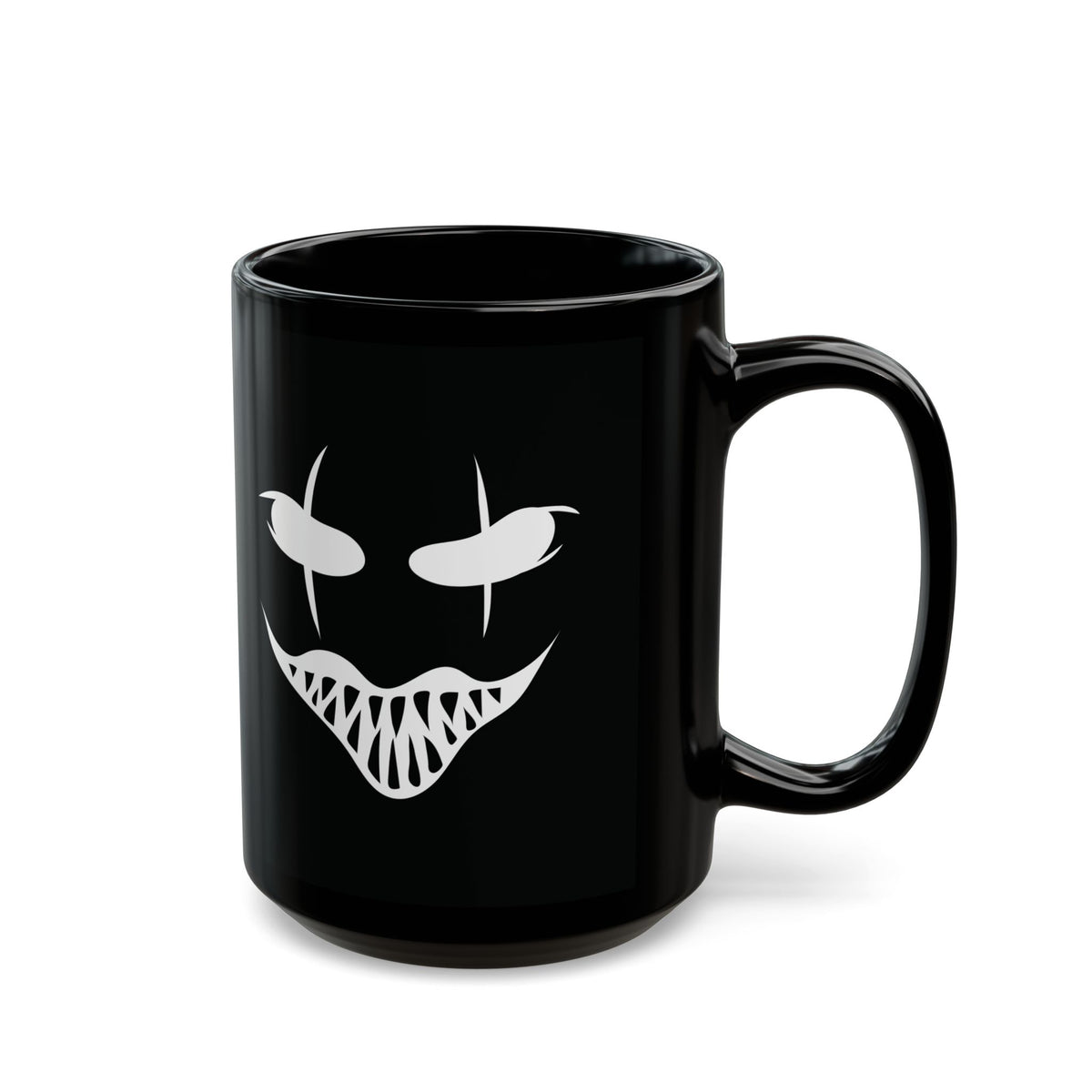 Isolated view of black ceramic Halloween coffee mug with spooky creepy grin design.