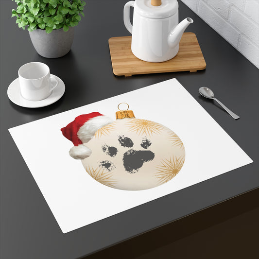 Cute Christmas placemat on a dining table featuring a dog paw print inside a festive holiday bauble with a Santa hat for pet lovers table setting decor.
