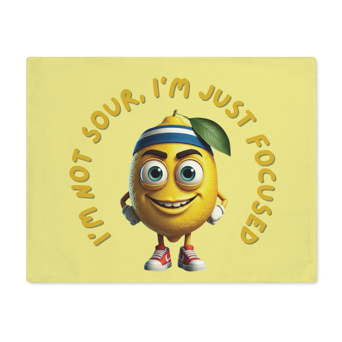 Flat front view of a yellow dining placemat featuring a funny determined cartoon lemon wearing sneakers with yellow text reading I'm not sour, I'm just focused.