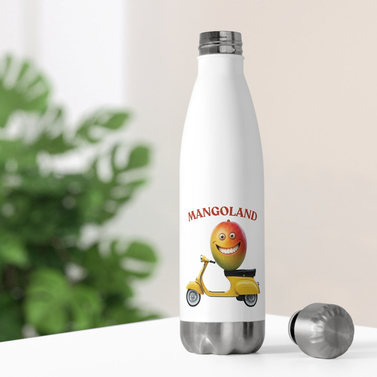 White thermal travel water bottle sitting on a bright desk with its stainless steel cap off, showing a smiling mango character riding a moped illustration.