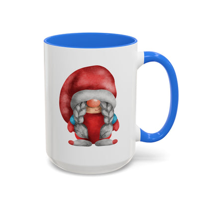 Red gnome light blue mug with braids next to a cozy knit sweater and a book)