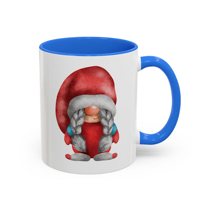 Red gnome light blue mug with braids next to a cozy knit sweater and a book)