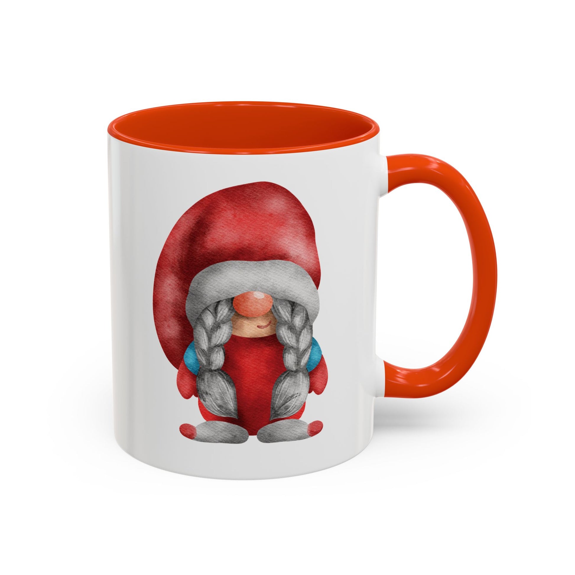 Red gnome orange mug with braids next to a cozy knit sweater and a book)