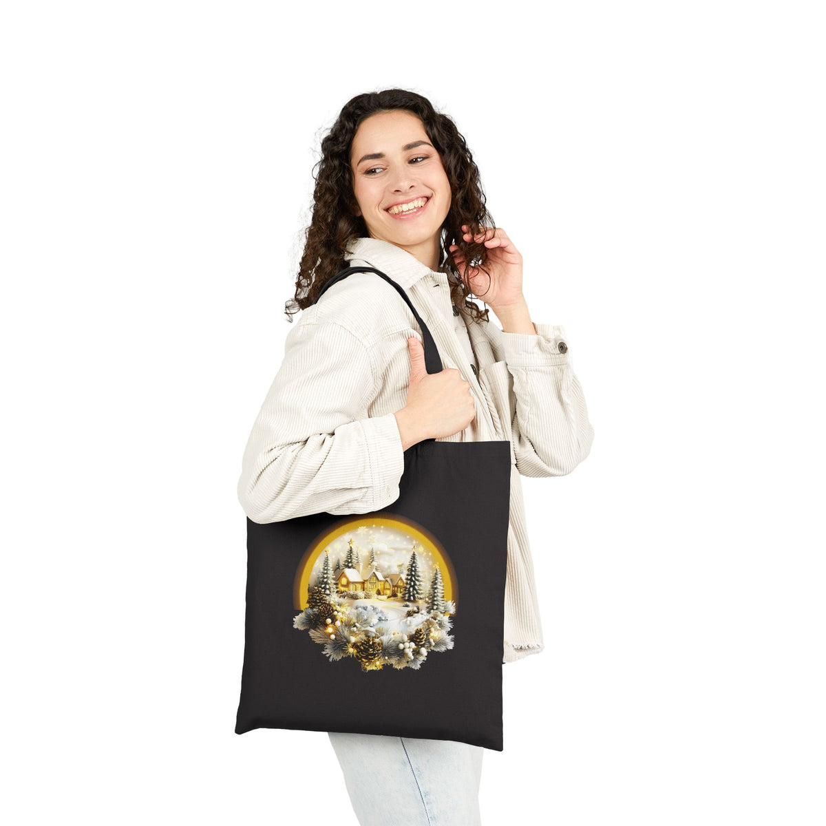 Woman wearing white jacket carrying a black golden winter village christmas tote bag for holiday shopping