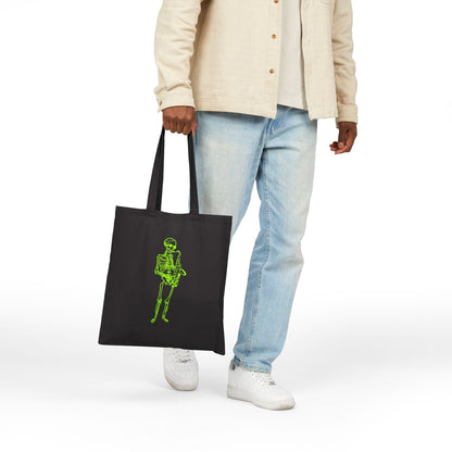 Person holding a black tote bag with a green skeleton design playing sax