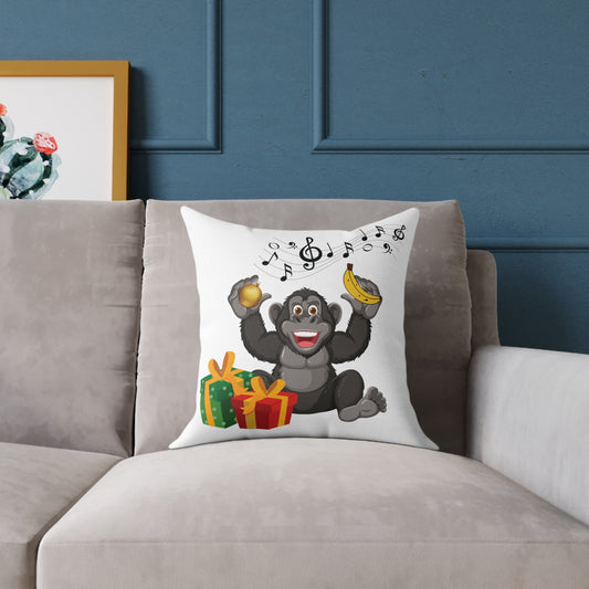 Playful Christmas throw pillow featuring a cheerful gorilla with musical notes, holiday gifts, and a golden ornament displayed on a living room couch.