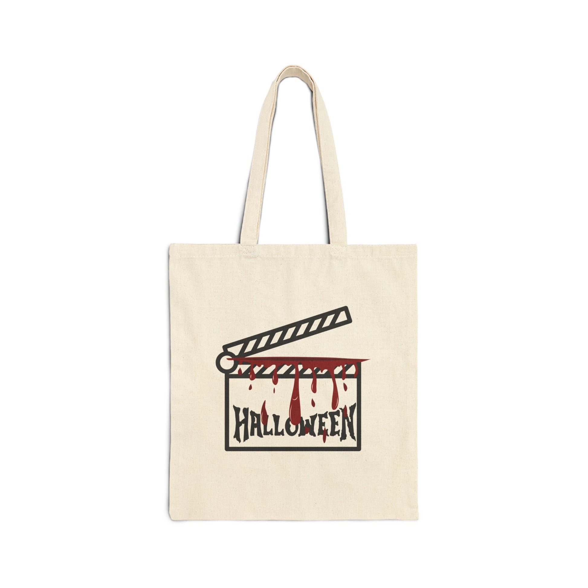 Beige tote bag with Halloween-themed design featuring a clapperboard and blood on a white background