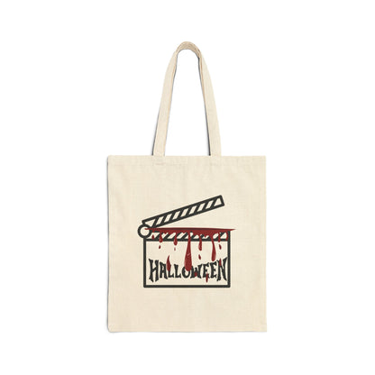 Beige tote bag with Halloween-themed design featuring a clapperboard and blood on a white background