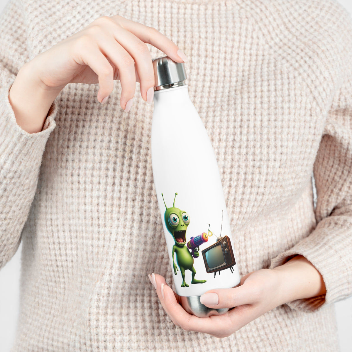 Close-up of hands opening the leak-proof screw cap of a white insulated travel water bottle with funny retro sci-fi alien artwork.