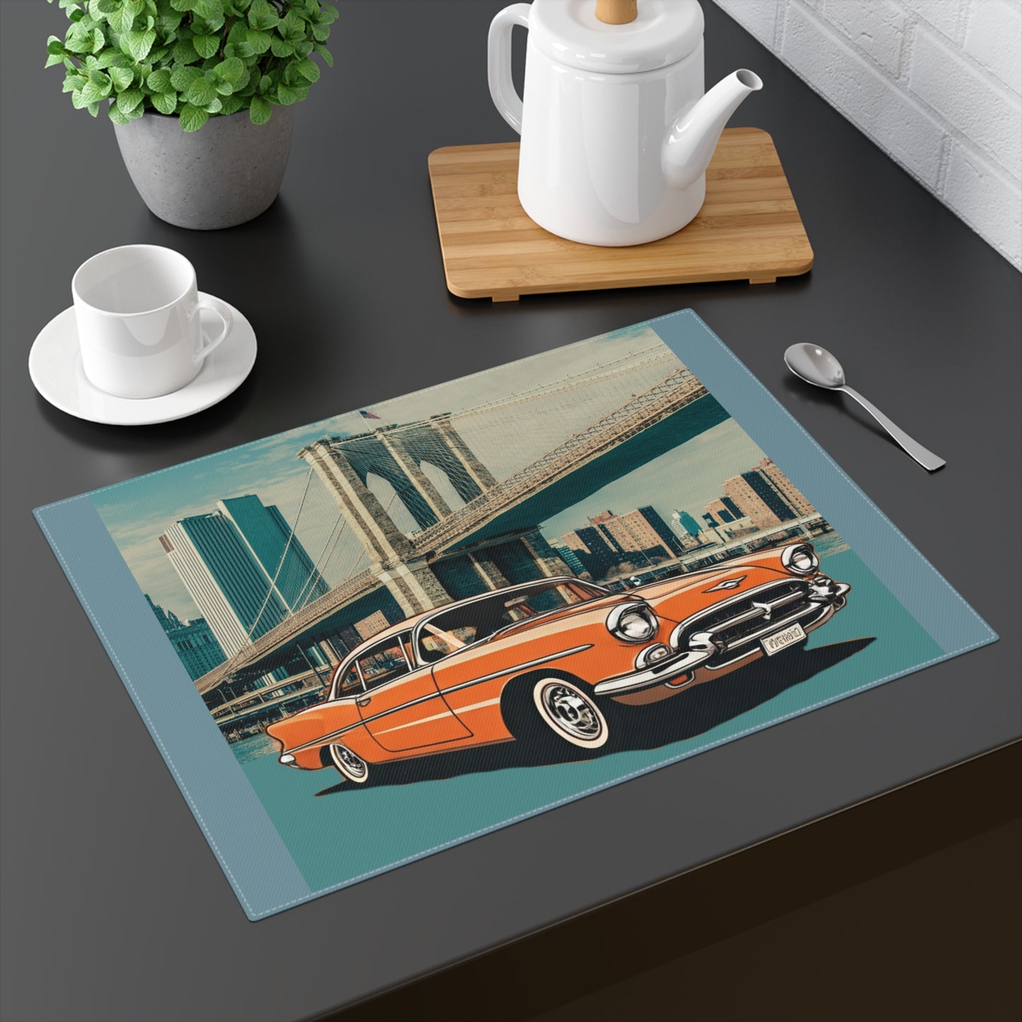 Orange 1950s Chevrolet Bel Air parked in front of the Brooklyn Bridge on a cotton placemat.
