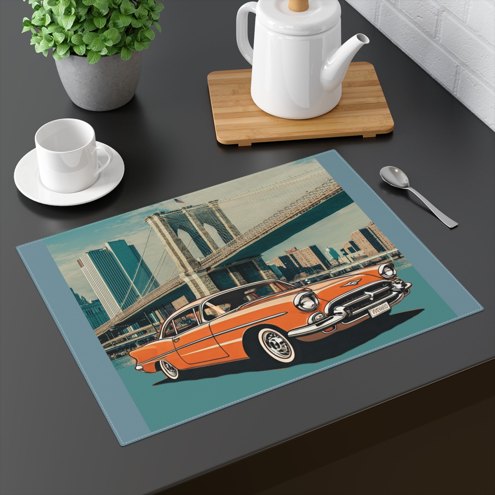 Orange 1950s Chevrolet Bel Air parked in front of the Brooklyn Bridge on a cotton placemat.