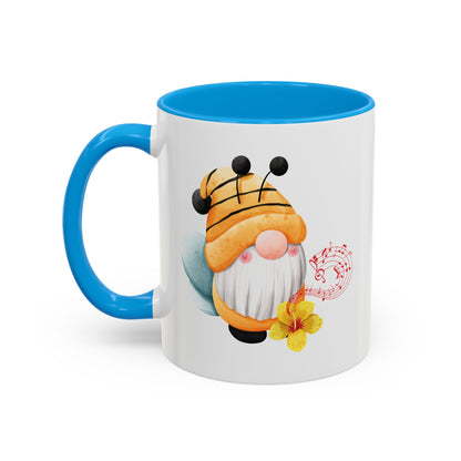 Orange 15oz cup with light blue c-handle with a cartoon bee gnome design 