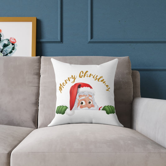 Decorative Christmas throw pillow featuring a cute peeking Santa Claus with gold Merry Christmas text on a cozy living room couch for festive holiday home decor.