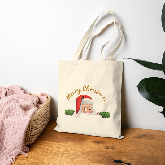 Peeking Santa Merry Christmas canvas tote bag featuring a cute santa claus illustration on natural cotton canvas