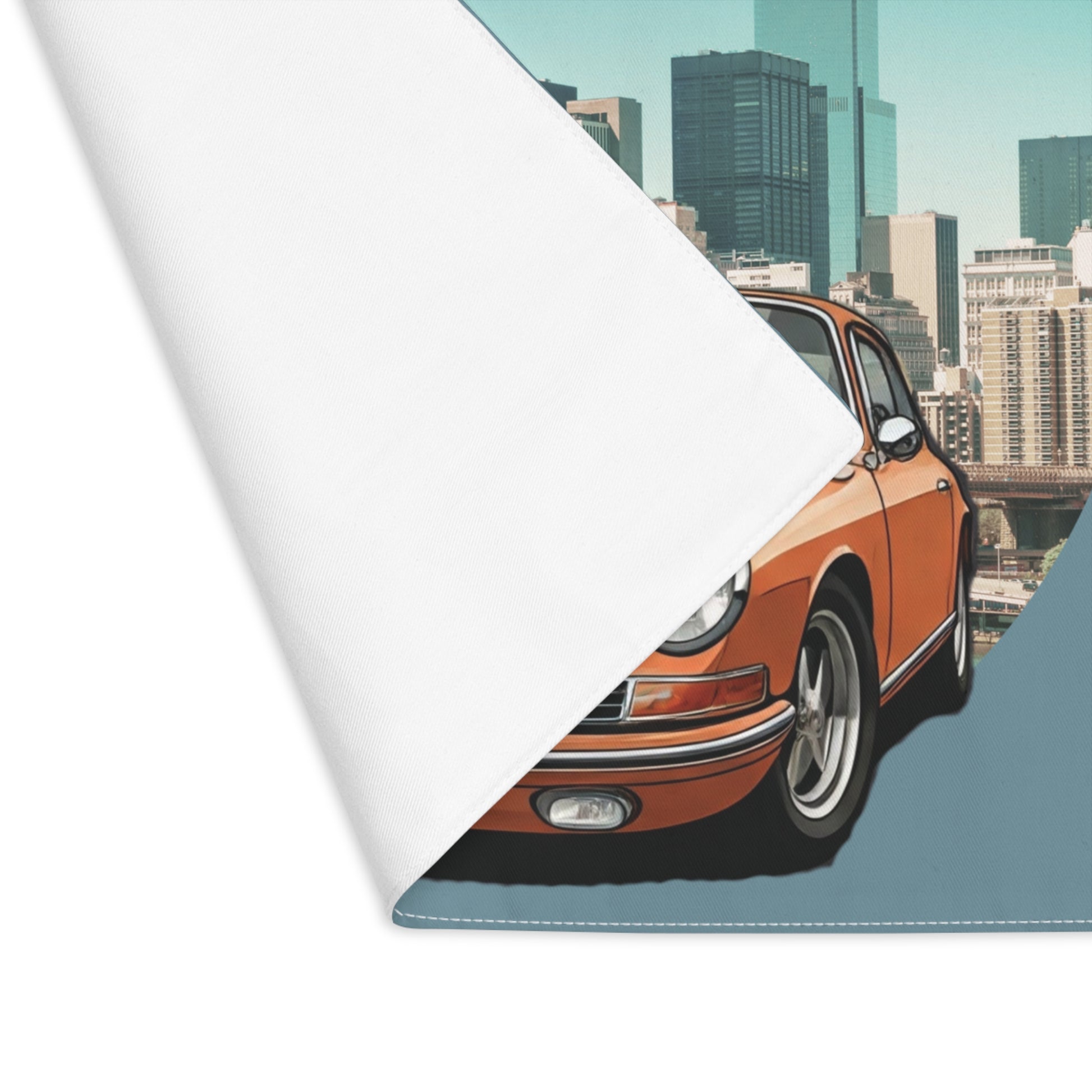 Roll of placemat with a vintage car design on a cityscape background