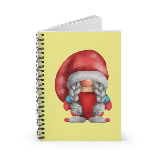 Watercolor illustration of a sweet female gnome (Lady Gnome) in a red outfit and large red hat, sitting down and featuring long gray braids with blue accents, printed on the cover of a yellow spiral notebook.