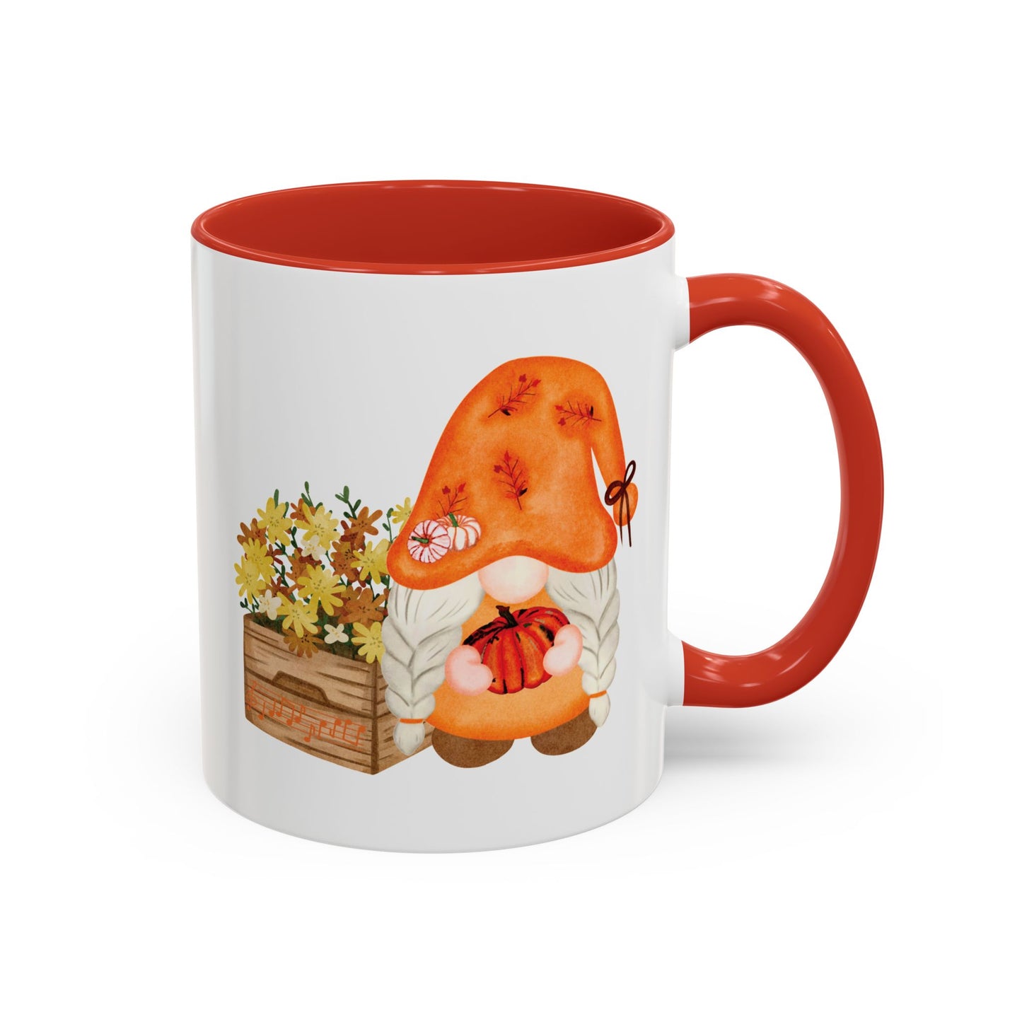 White and red ceramic coffee mug with a colorful graphic of a mysterious gnome surrounded by autumn leaves and mushrooms.