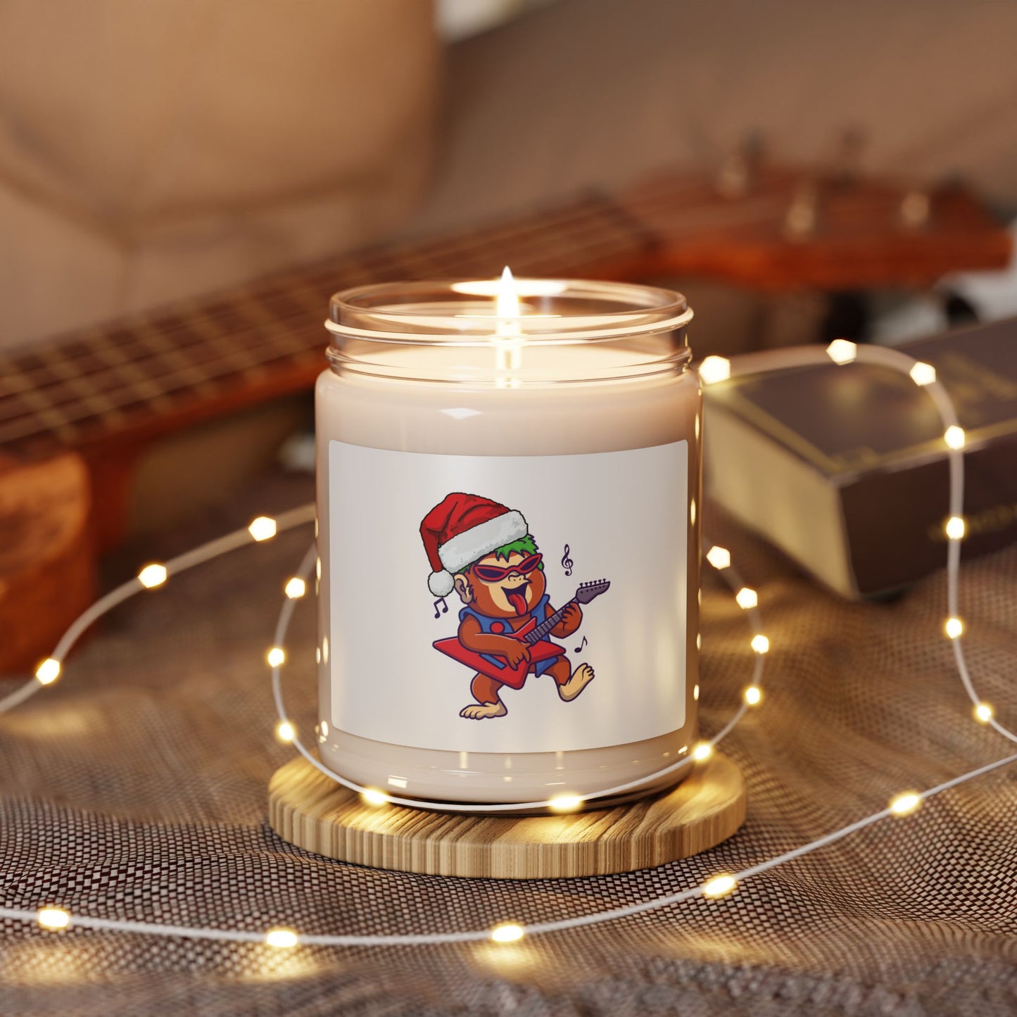 Rockin' Monkey Christmas Candle, close-up of the festive red wax and holiday scent label. Luxury Christmas decor item.
