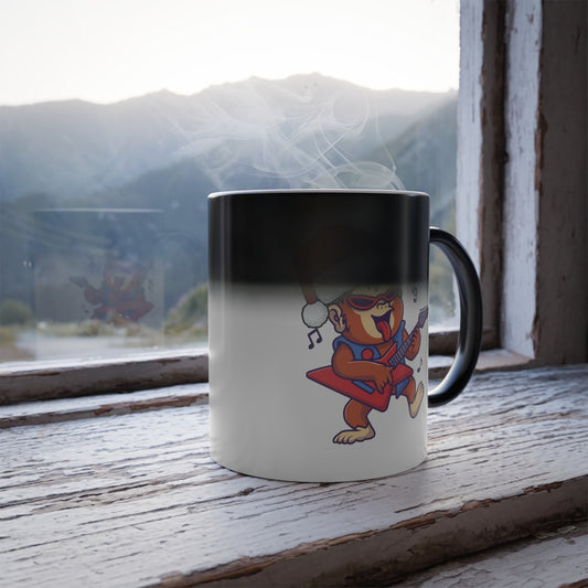 Heat sensitive color changing mug revealing a cool rockstar gorilla playing electric guitar with a Santa hat on a rustic wooden windowsill with a mountain view.   