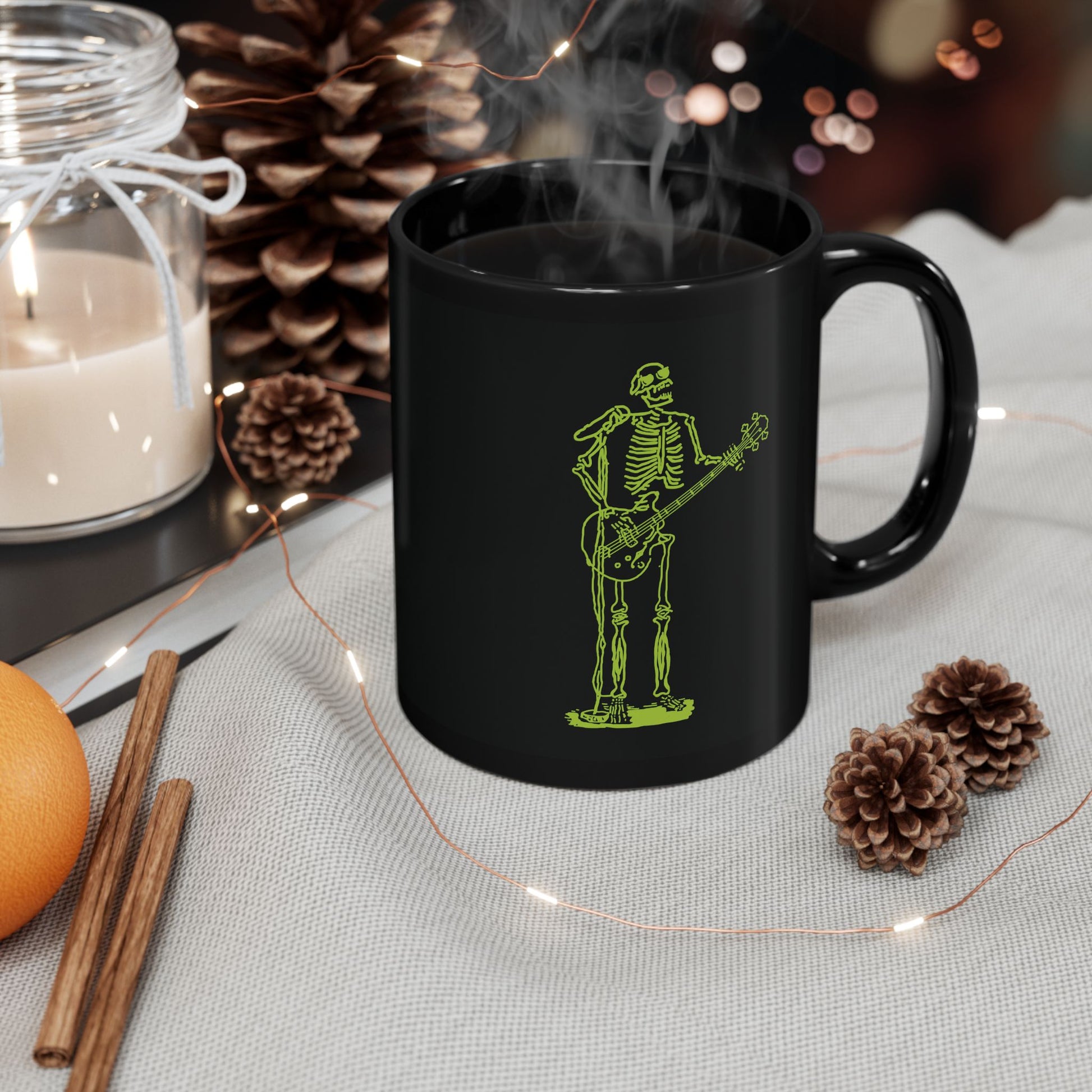Black mug with a green fluo metal skeleton playing guitar and singing design