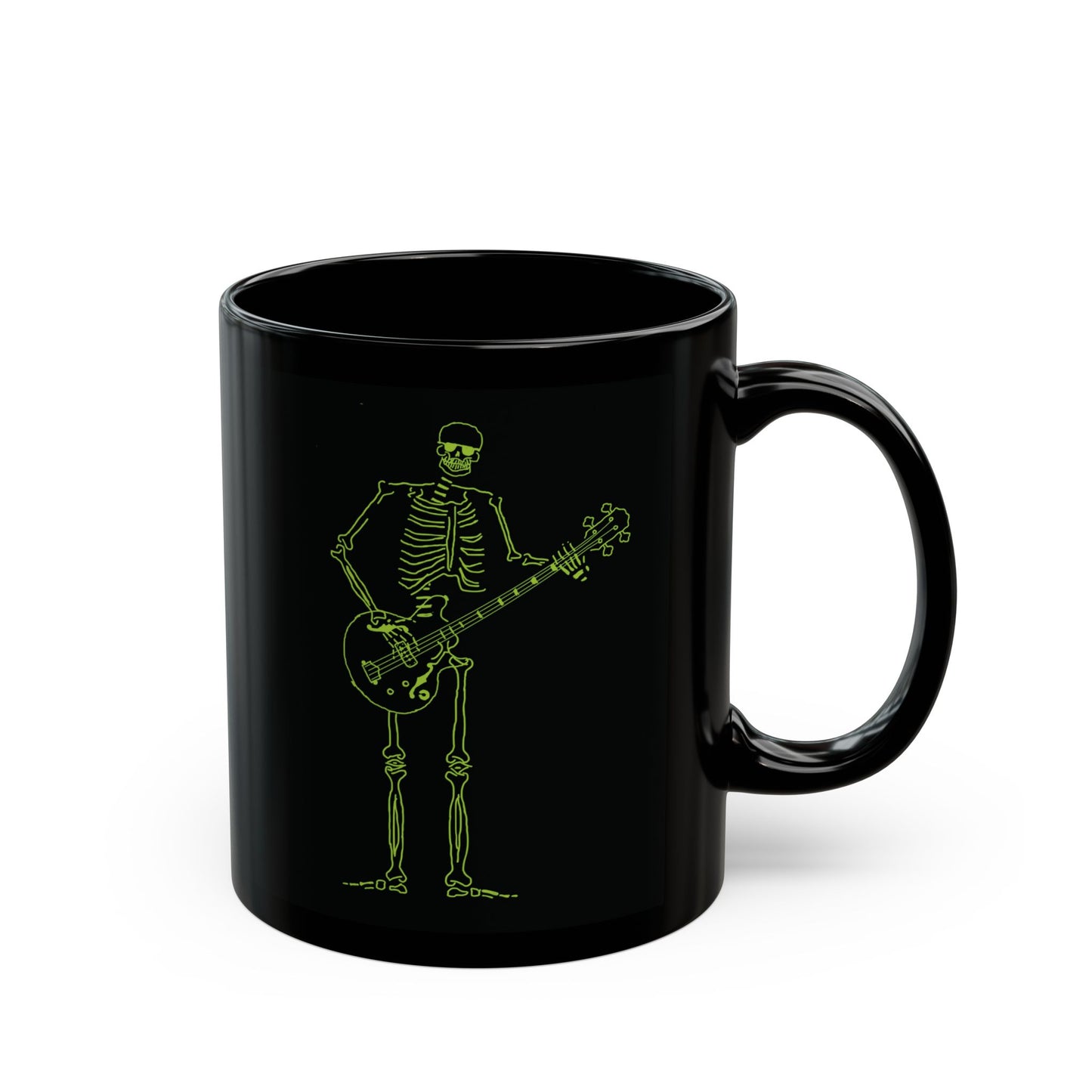 Photo of the black heat-sensitive mug showing the full revealed graphic of a skeleton playing a bass guitar.