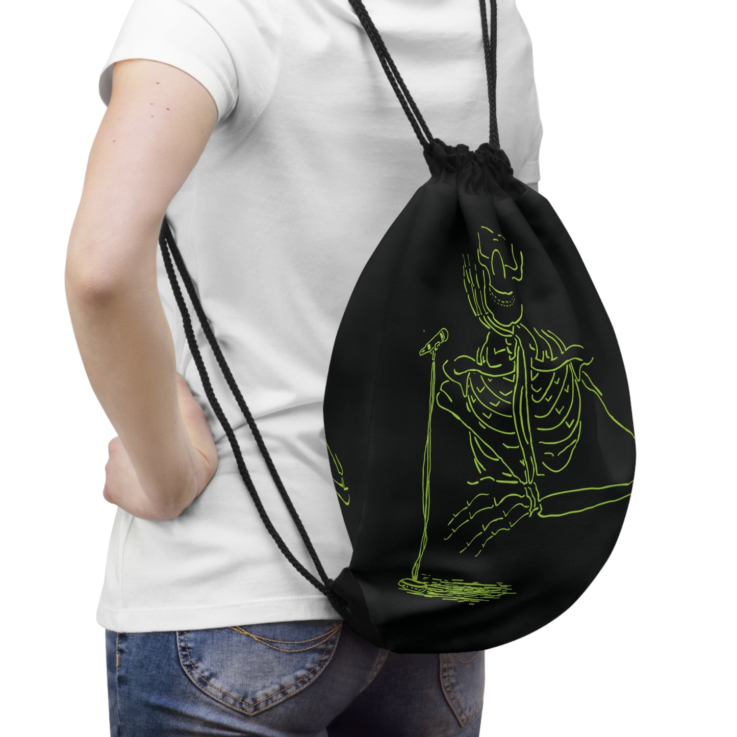 Person wearing a black drawstring bag with a green skeleton design 